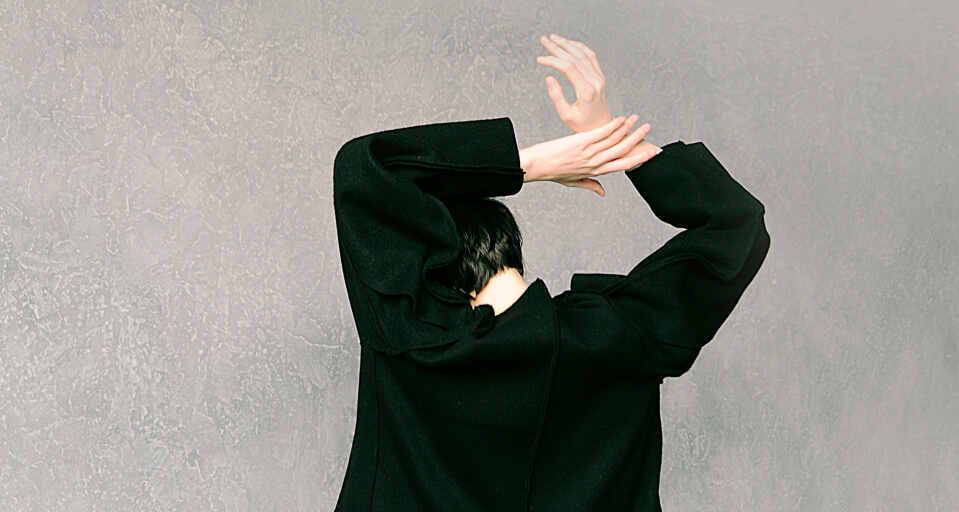 high-fashion female model in black wool coat